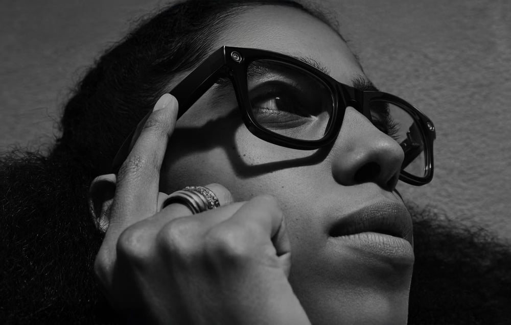 A woman using the touch panels on AI glasses