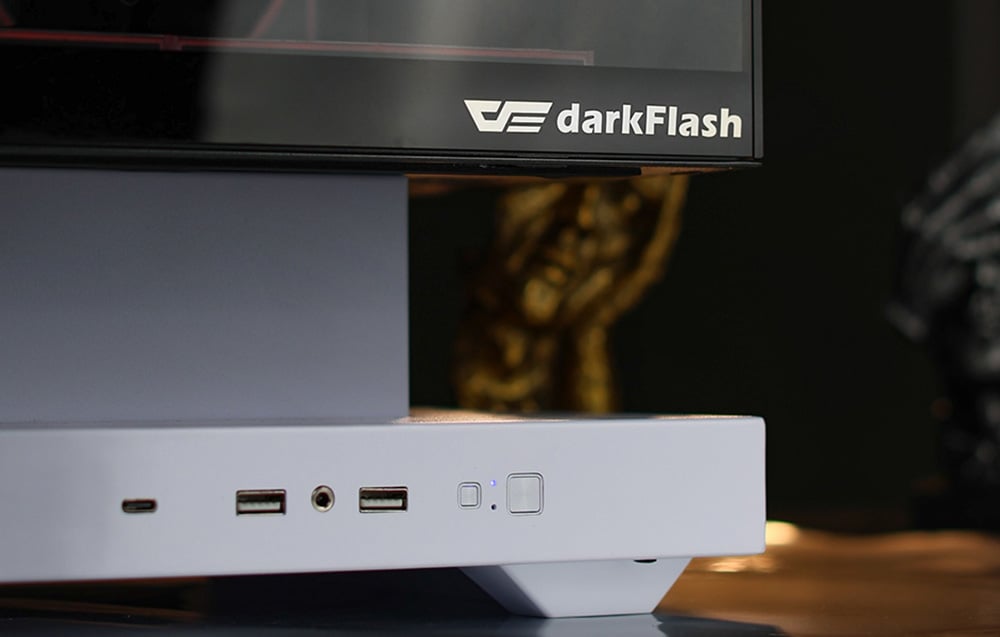 Close-up of the white base of the computer case with visible ports