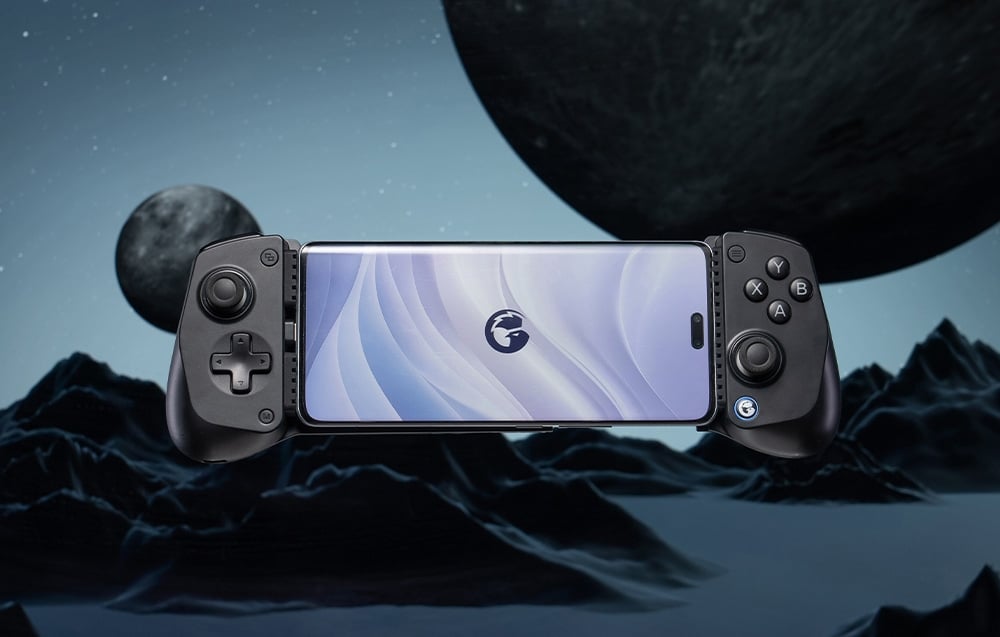 Black GameSir controller with mounted smartphone against a landscape with planets.