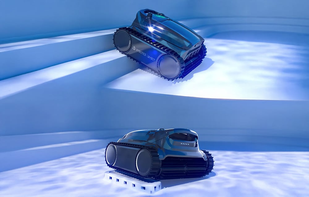 Two pool robots Wybot on the entrance steps of the pool