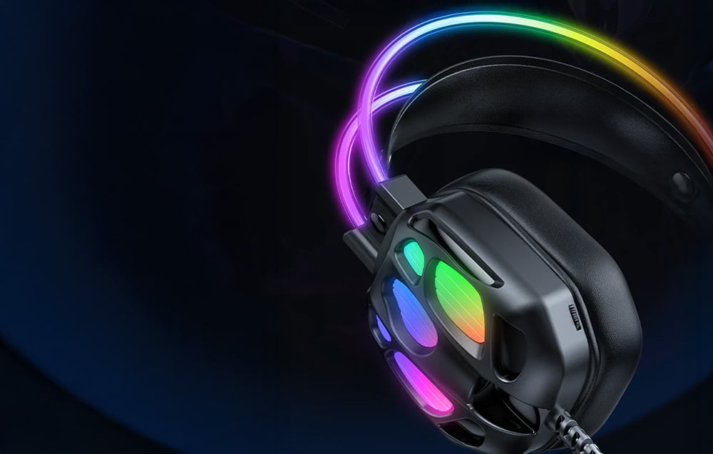 Close-up of earphones with colored backlight on black background