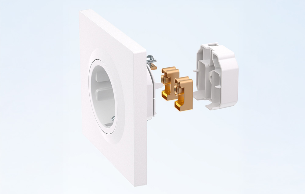 A diagram of the outlet’s construction showing the internal copper contact elements and white housing