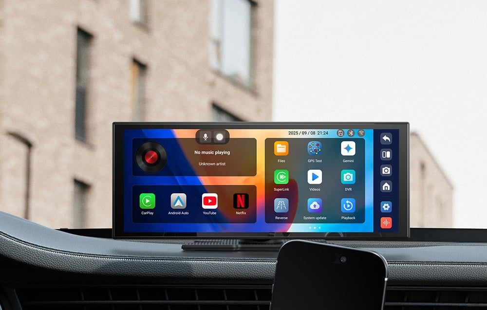 A portable multimedia screen with app icons sits on the dashboard next to the phone