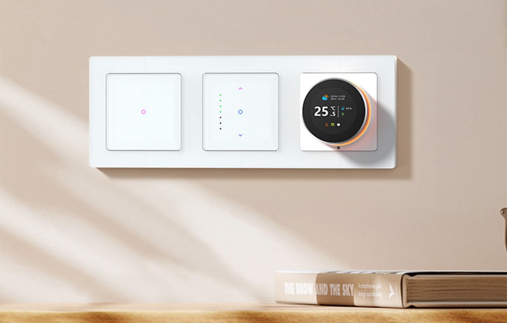 Touch light switches and thermostat on bright wall