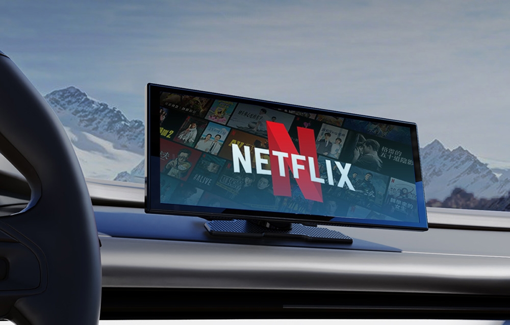 Portable car screen with the Netflix logo mounted on the car dashboard