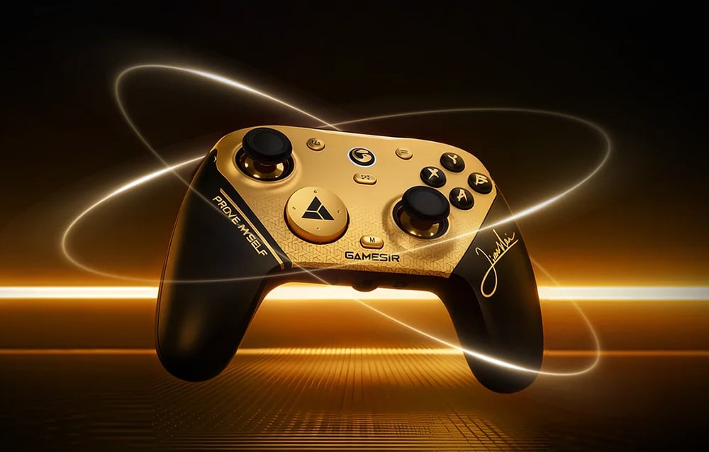 Gold-and-black game controller on a dark background with lighting effects around the device