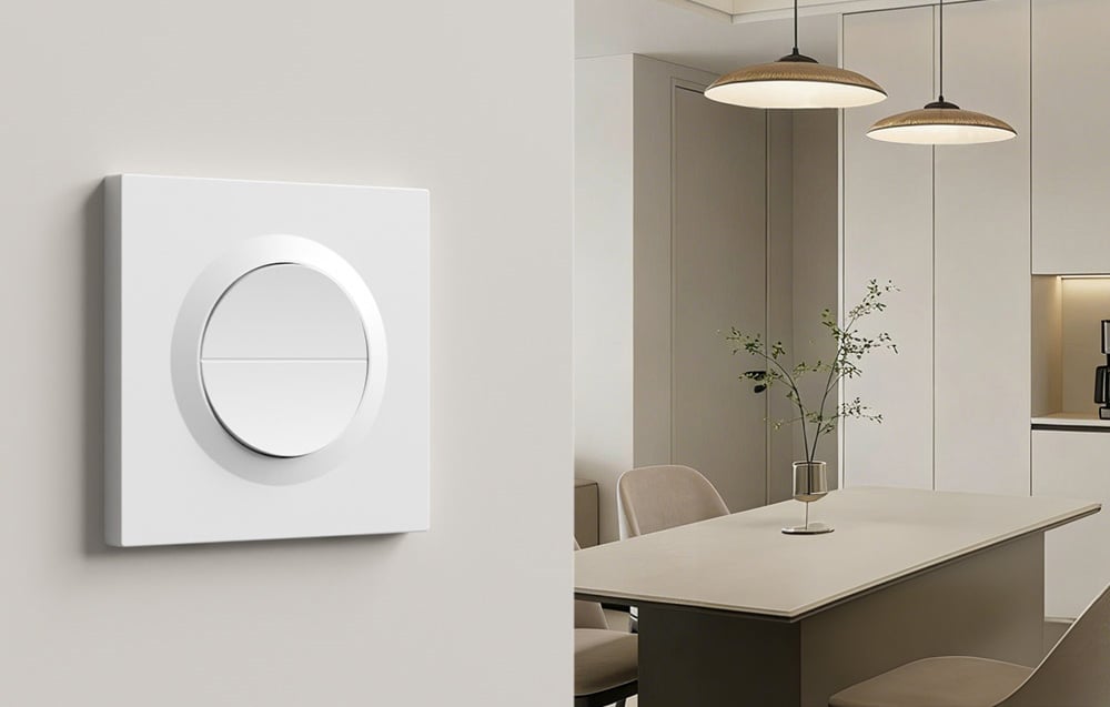 Minimalist SONOFF Orb-ZBW2 switch mounted on the wall in an elegant dining room with pendant lights and modern decor