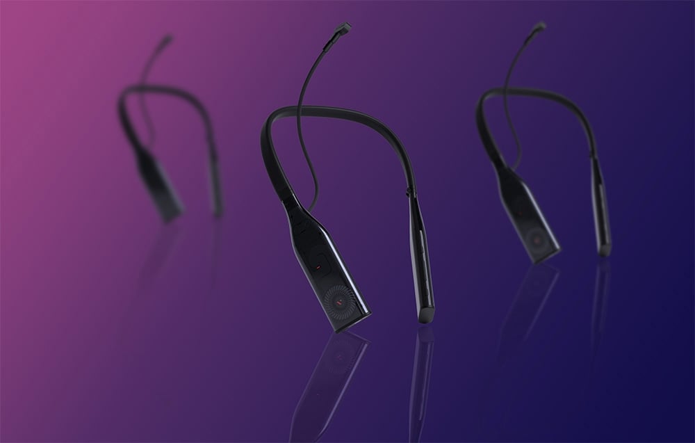Three identical neckband devices float on a purple background with reflections on a glossy surface