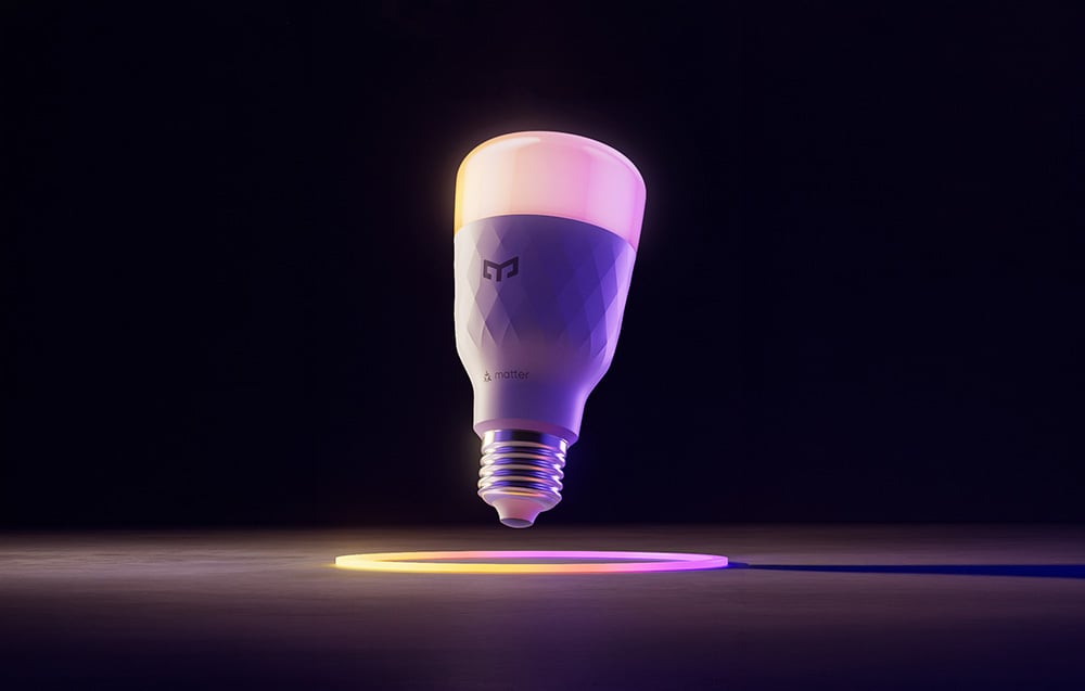 Yeelight smart bulb on a dark background with a colored circle