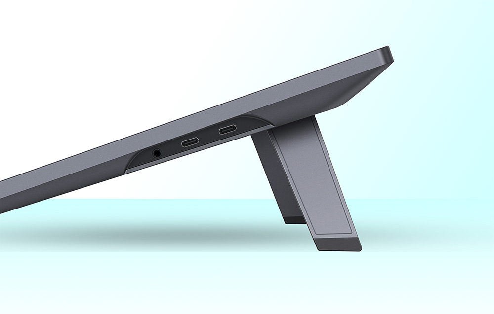 Huion graphics tablet with side showing USB-C ports and adjustable stand