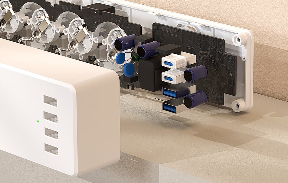 Interior view of the power strip with exposed electronics and USB outlets and surge protection components