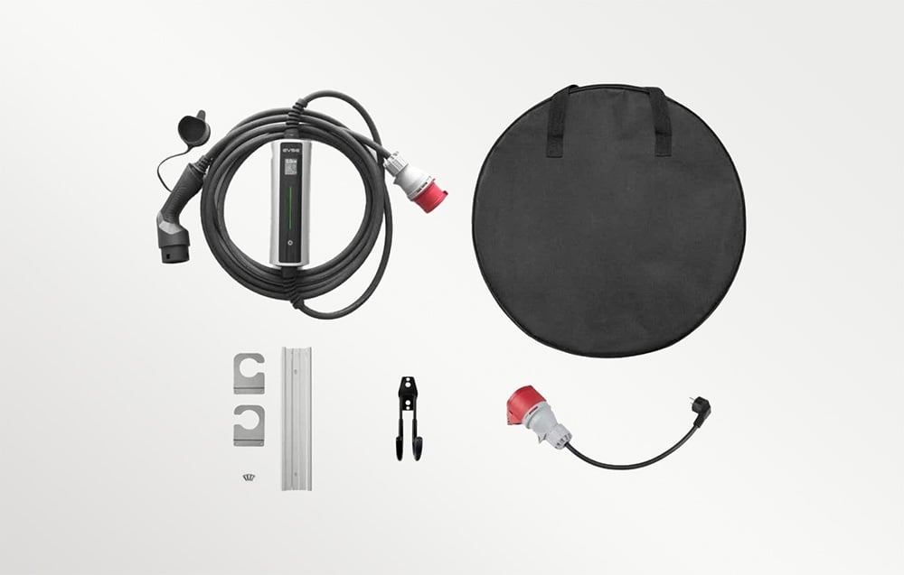 Components of the portable charger kit: carrying case, plug, adapter, handles