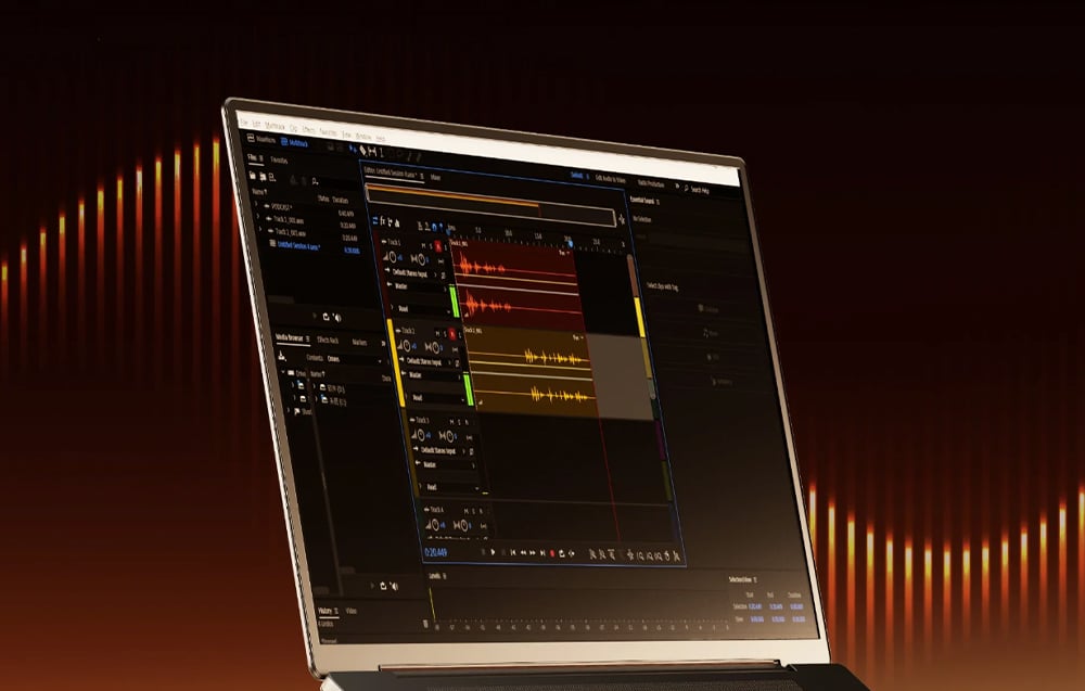 A laptop screen displaying professional software for editing and mixing audio tracks