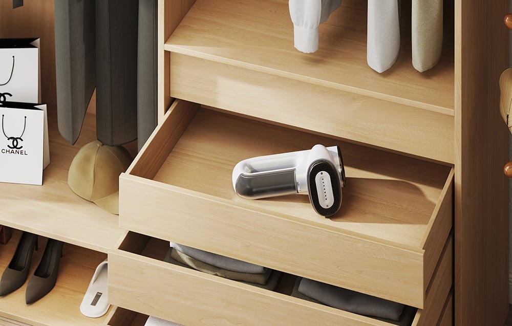 The white steamer lies in an open wooden drawer