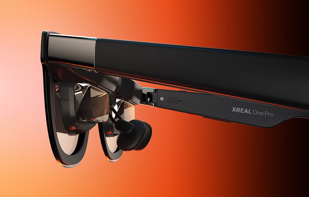 black AR glasses on a gradient orange-red background