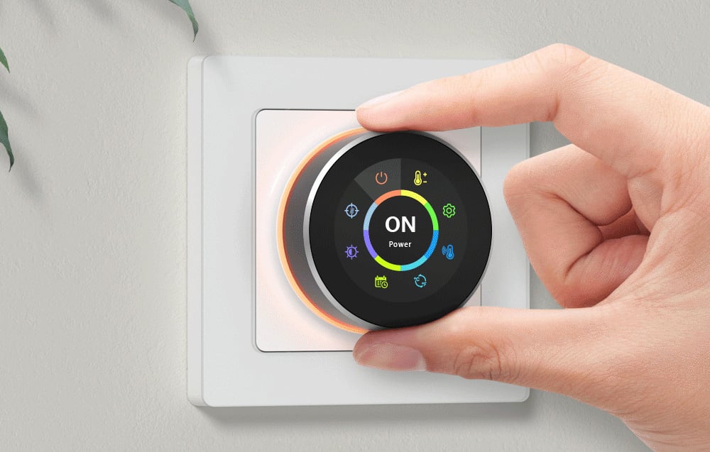 Hand setting the temperature on the thermostat