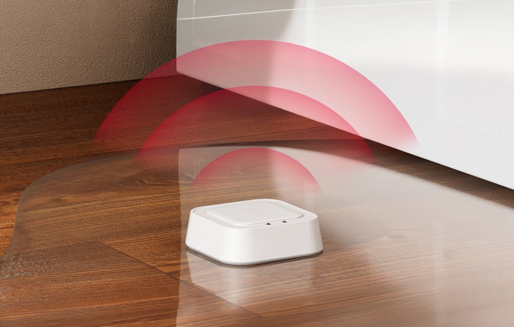 MEROSS Smart Water Leak Sensor on a wooden floor