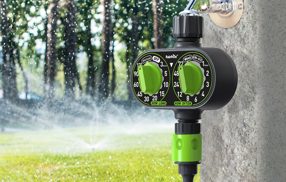 RainPoint dual irrigation controller with green knobs against the backdrop of a sprinkler operating in the garden