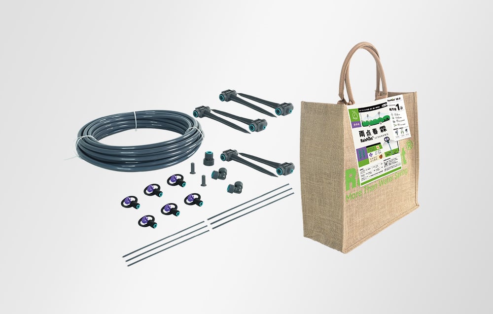 Irrigation kit: gray hose, connectors, drippers, and stakes next to a jute bag with the RainPoint logo