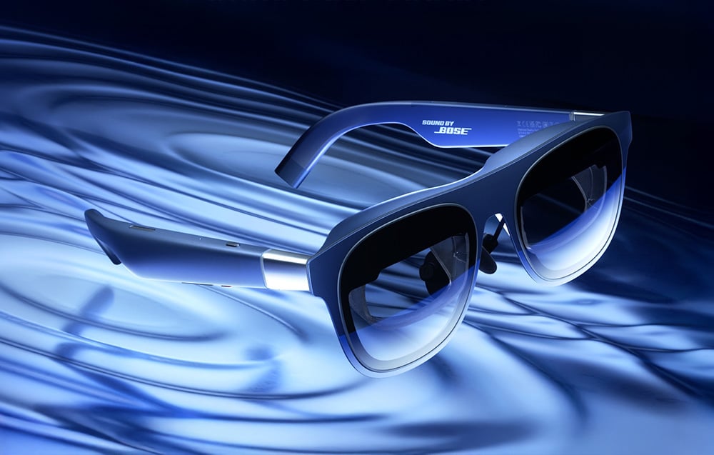 XREAL glasses against a backdrop of blue water
