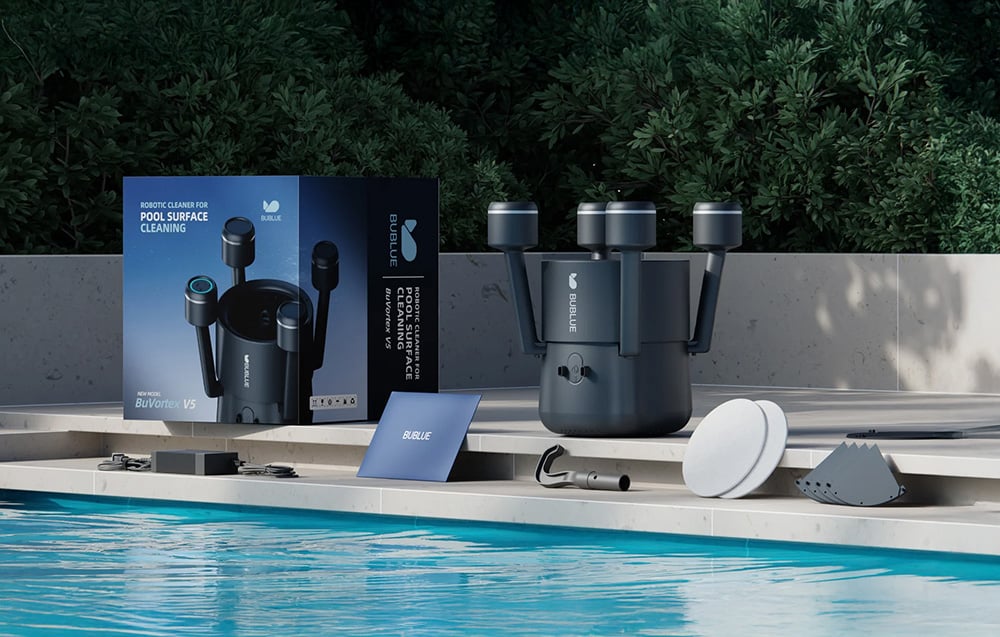 The BuVortex V5 robot on the pool deck, along with its packaging and a complete set of accessories