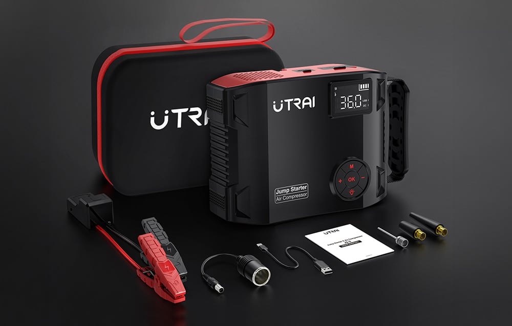 A complete car jump starter kit with accessories, a user manual, and a black travel case.