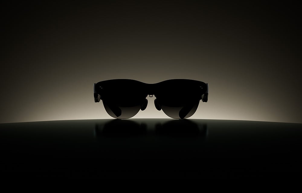 Futuristic sunglasses shown in a dark frame with backlighting