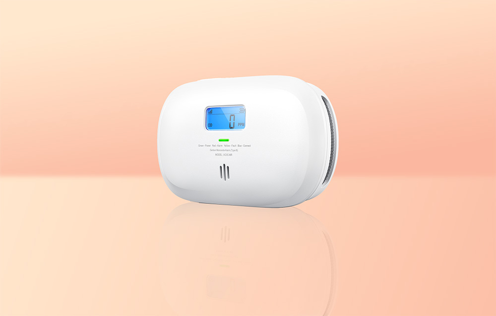 X-Sense XC0C-MR Link+ carbon monoxide detector on a bright orange background