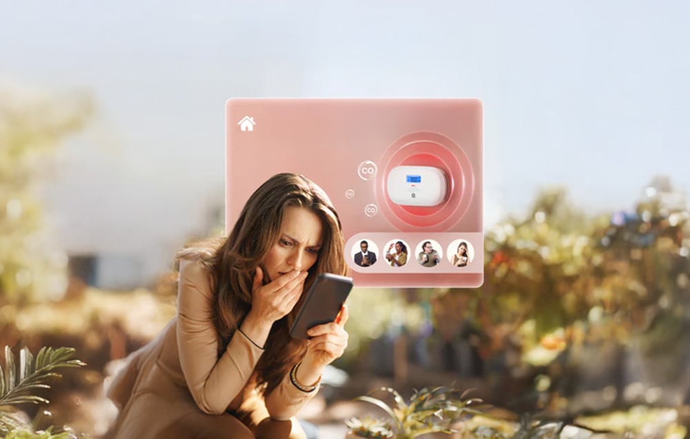 Woman outside looking anxiously at phone, next to graphic showing CO detector and alert notification