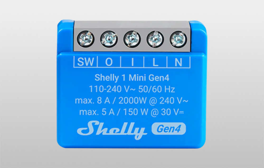 Close-up of the front of the blue controller showing terminal labels and mounting screws.