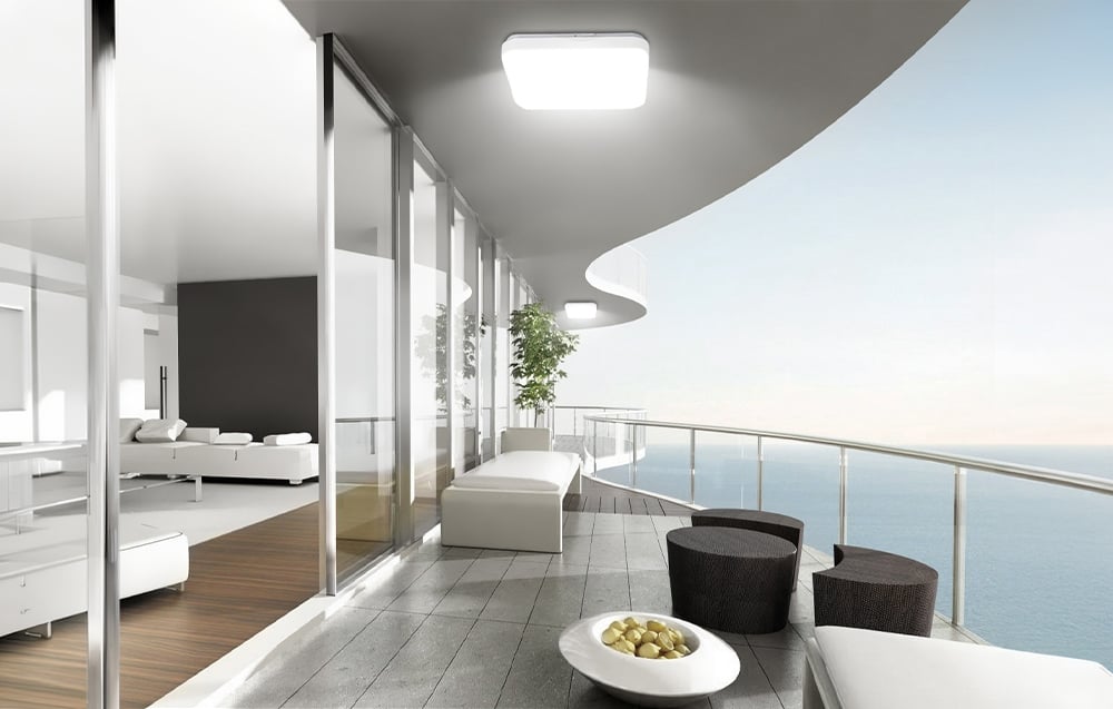 An apartment with a terrace lit by white ceiling lights