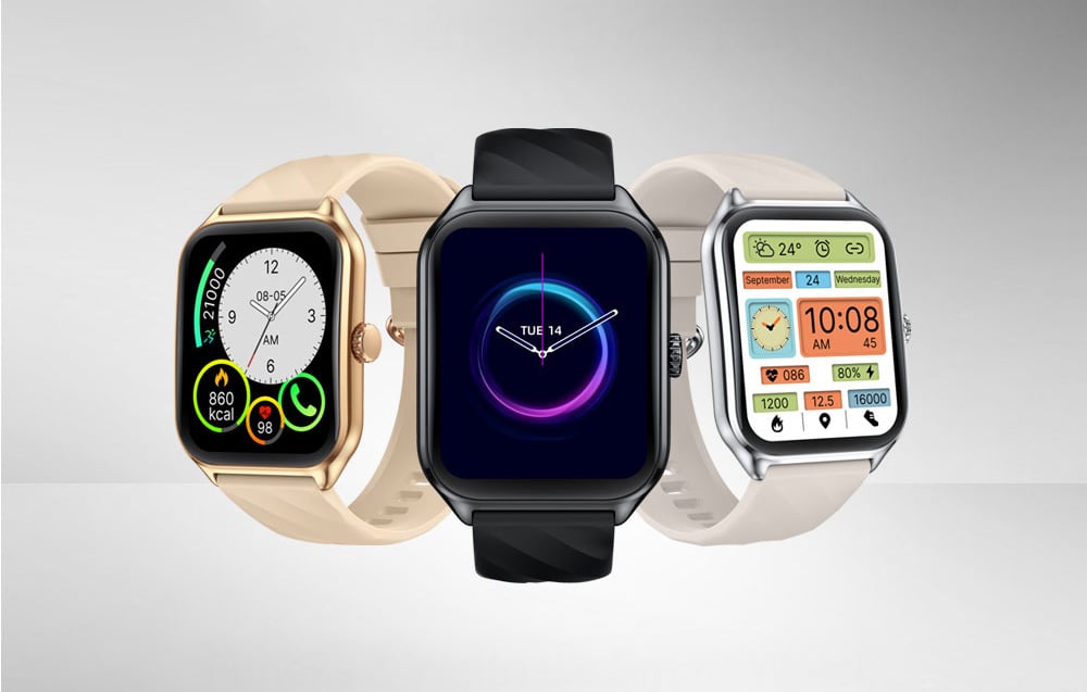 Three Zeblaze smartwatch models in gold, black and silver standing side by side