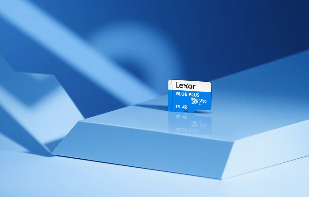 Lexar Blue Plus microSDXC memory card displayed on a modern, geometric stand in a blue shade.