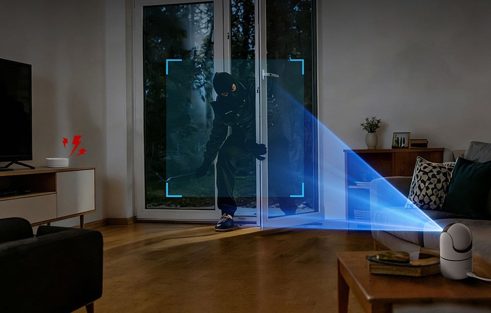 A camera recording a burglar entering the living room through the balcony door