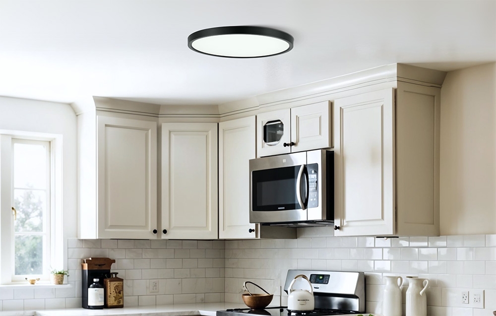 Yeelight Meteor C300 ceiling lamp mounted in a bright kitchen with white cabinets and a metal microwave oven.