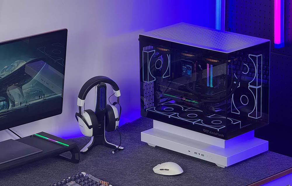 Gaming workstation with computer, monitor, mouse, keyboard and headphones on stand
