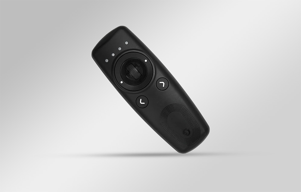 Black Shelly BLU remote control against a gray background