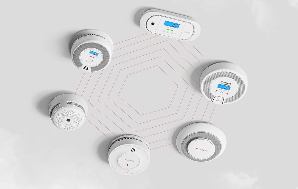 Six different X-Sense sensor models arranged in a circle, connected by dotted lines on a gray background