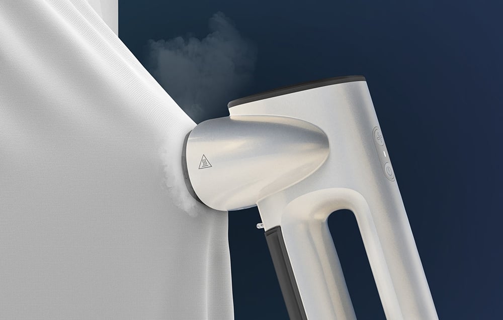 A white steamer with a long handle floats over a white fabric against a dark blue sky with clouds
