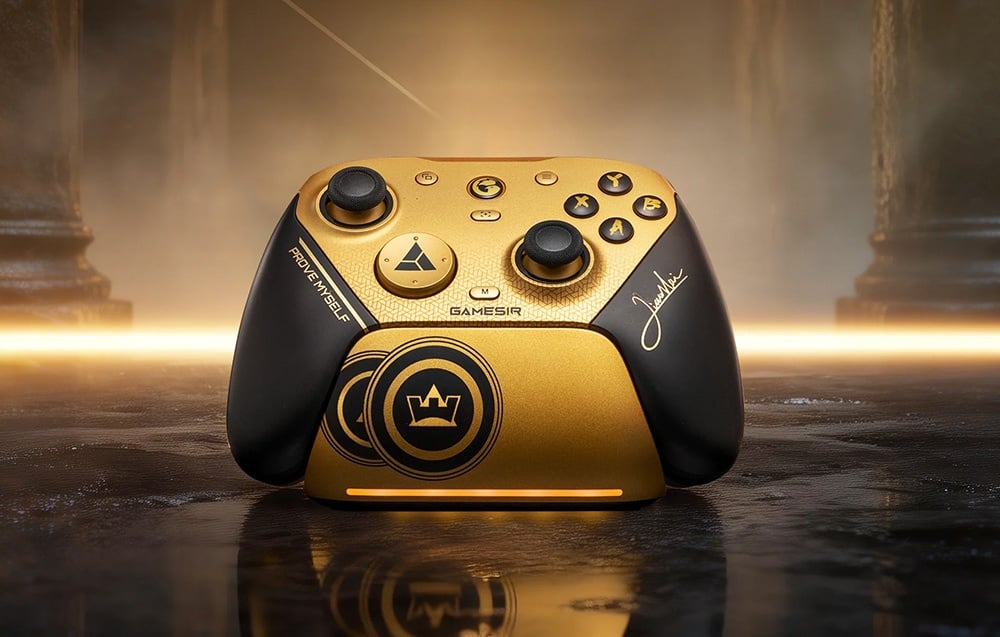 Gold-and-black game controller placed on a docking station with backlighting and a dark background