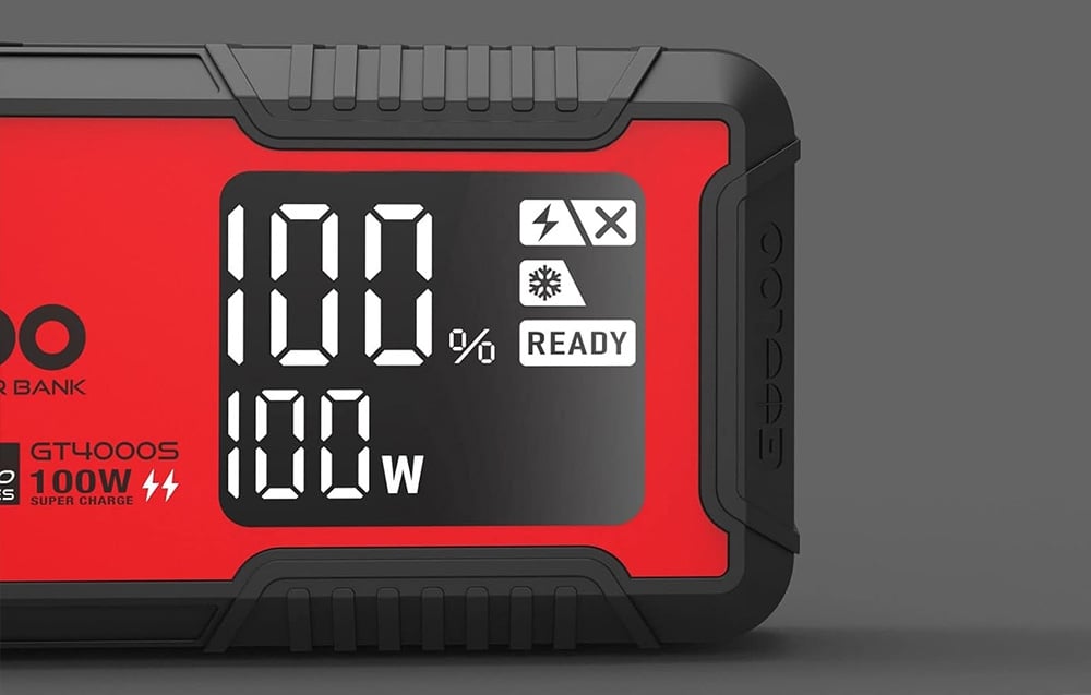 Close-up of the car starter display showing 100% and 100 W