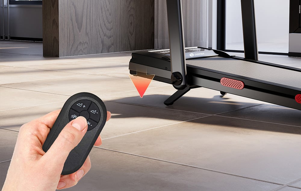 Hand holding a black remote control with a red arrow pointing to the treadmill height adjustment function
