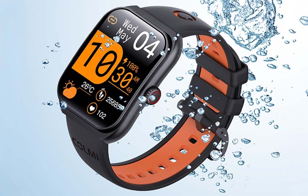 Black smartwatch with black and orange strap submerged in water.