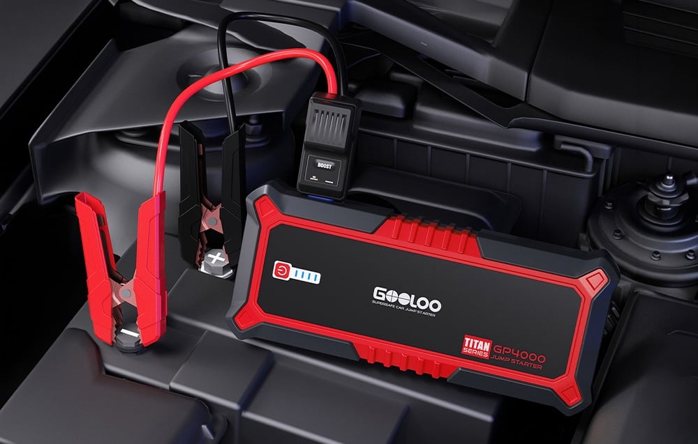 Car starter connected to the battery in the engine compartment