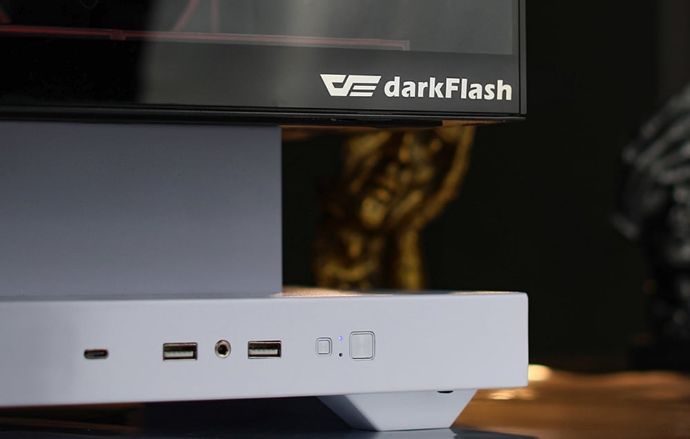 Close-up of white base of computer case with visible ports