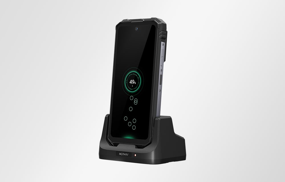 Smartphone placed in a dedicated docking station while charging.