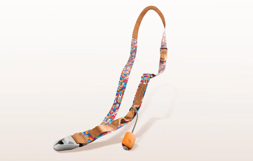 PGYTECH phone strap with a colorful pattern on a cream background
