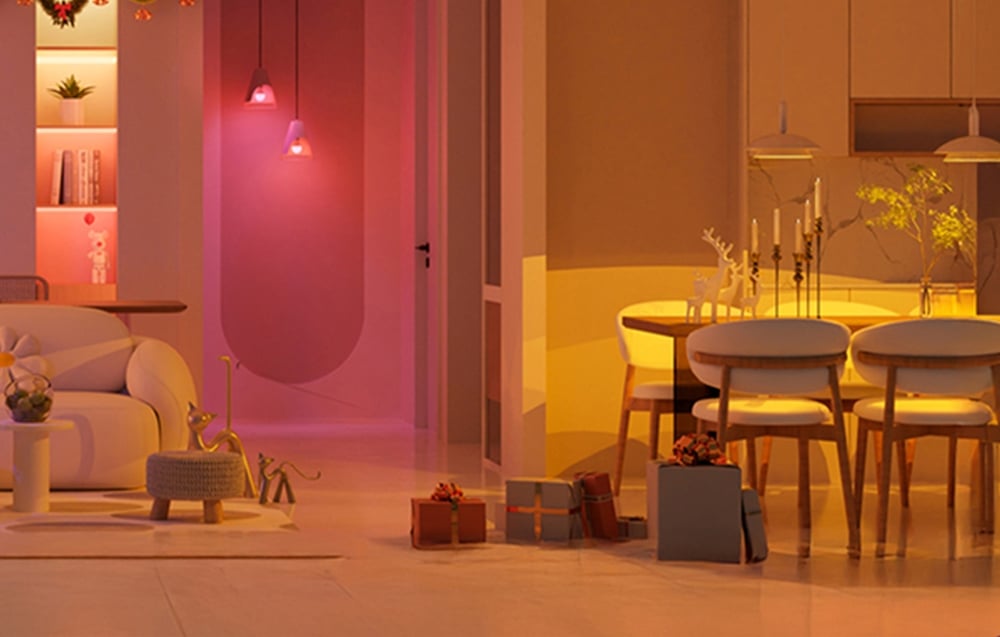 Dining room interior with a table, chairs, and gifts, illuminated by pink, purple, and yellow LED lights.