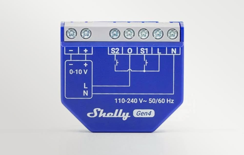 Front view of the blue Shelly Gen4 module, showing the electrical schematic and pin markings