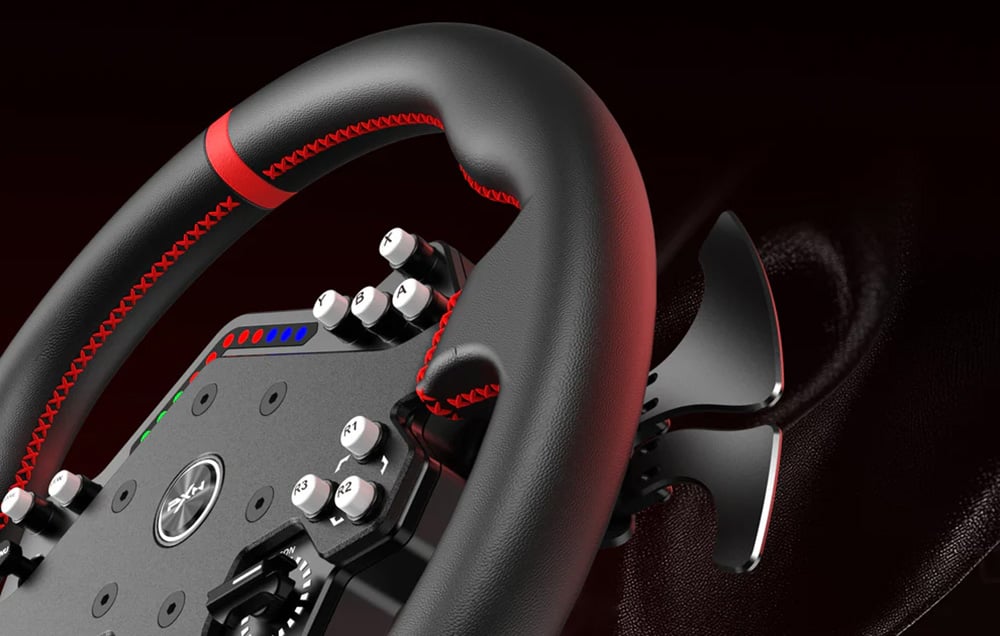 A close-up of the PXN steering wheel with textured surface, red stitching and visible buttons and paddles